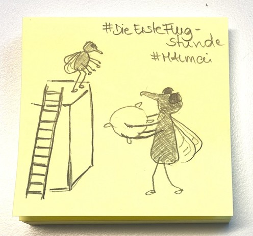 A post-it note with a hand-drawn sketch of a fly holding a pillow standing next to a podium with a ladder, and another fly with wings spread standing on top, ready to jump off the podium. Text above includes hashtags: #DieErsteFlugStunde and #MALmai